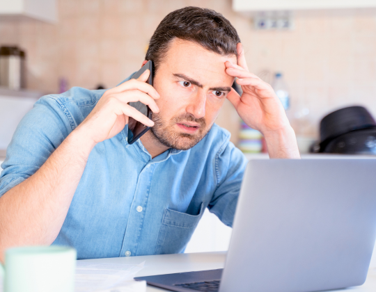 a frustrated man talking to customer support for setting up fiber in Japan