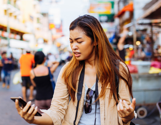 a woman holding a cell phone