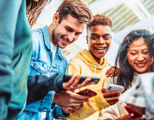 group of friends on phones
