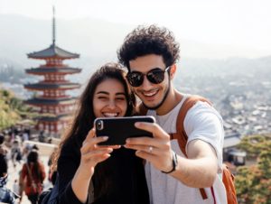 Couple taking smartphone picture in front of Kiyomizudera Temple