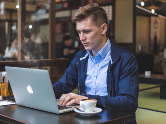 a man working remotely at a cafe