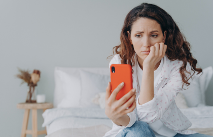 woman holding phone